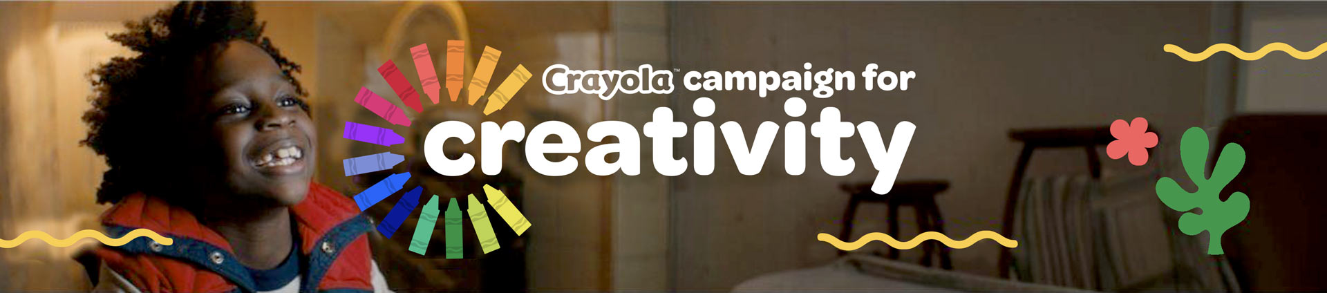 Young Happy Boy with Crayola Campaign For Creativity Logo