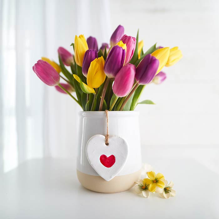 mothers day thumbprint ornament craft. front view of craft with flower bouquet.