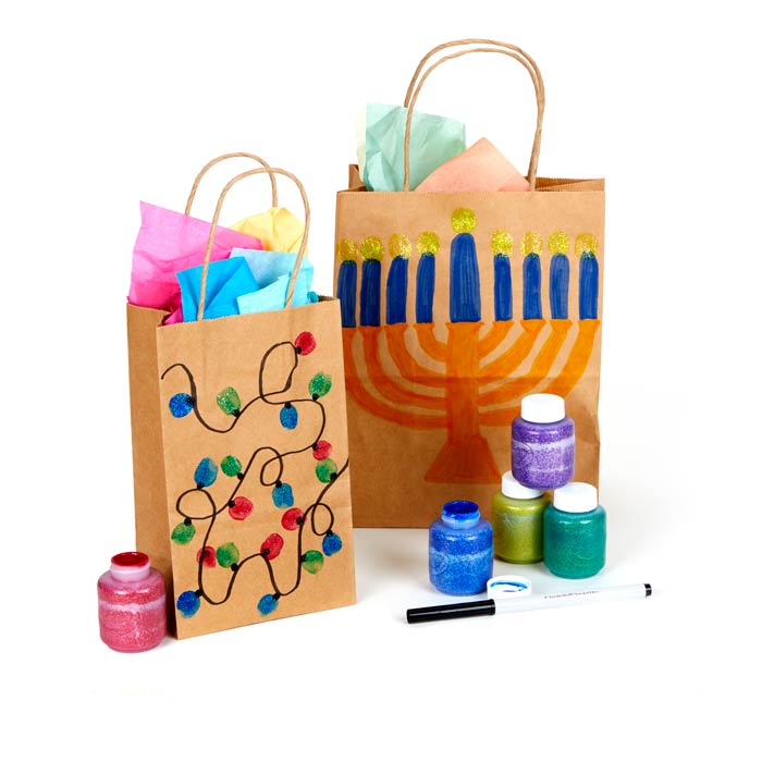 thumbprint holiday bags and tags craft. front view of bags with bottles of crayola paint.