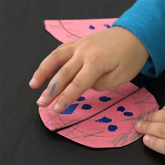 watermelon matching craft game. hand of a child interacting with craft.
