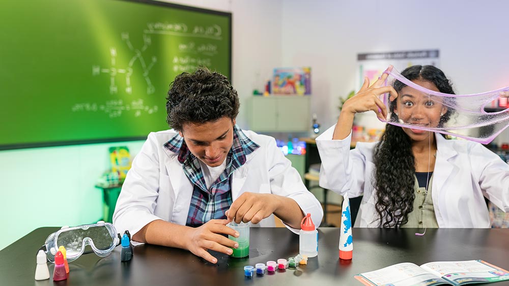 Teens in school science lab