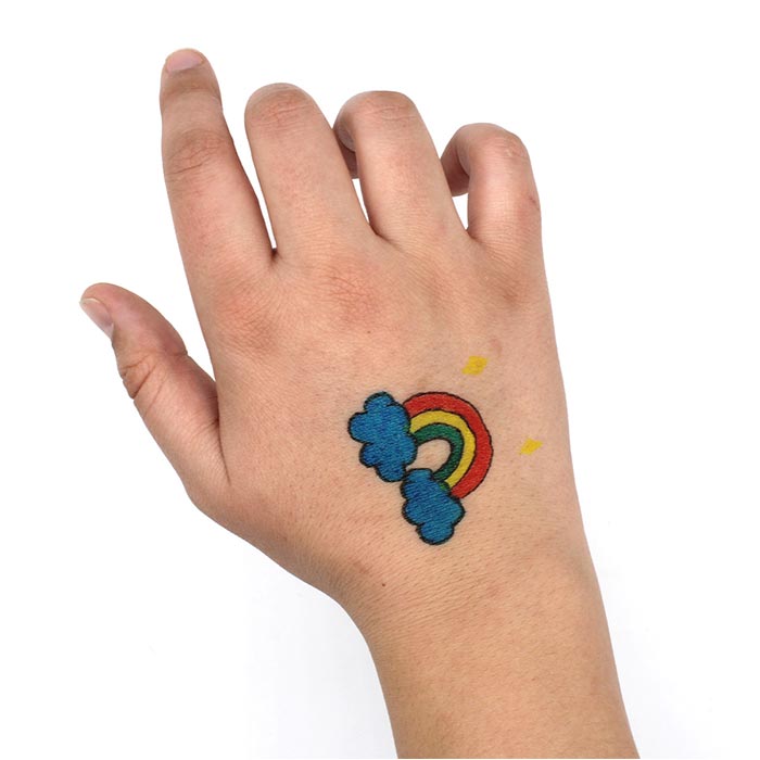 Crayola Temporary Tattoo Markers, 8 Count. Rainbow tattoo on hand.